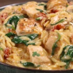 One Pan Marry Me Chicken Orzo served with creamy orzo, chicken breast pieces, spinach, and sun-dried tomatoes