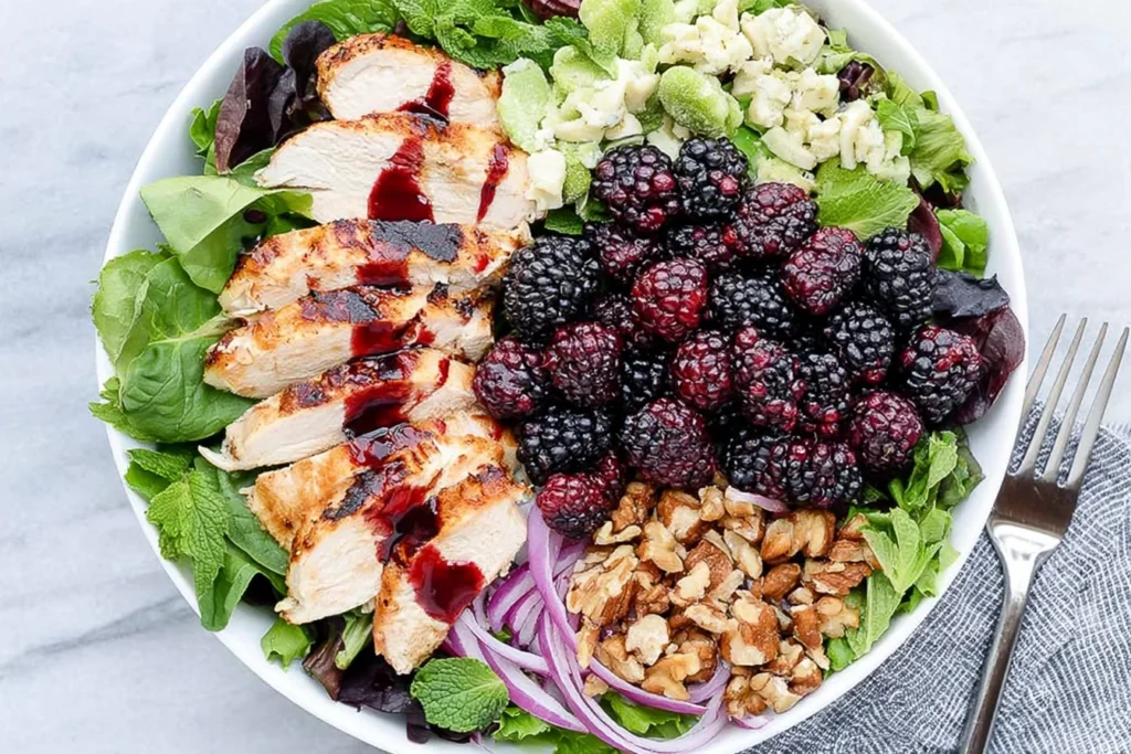 Blackberry Chicken Salad with grilled chicken, fresh blackberries, feta cheese, walnuts, and mixed greens with berry dressing