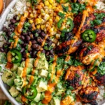 Cilantro Lime Chicken Bowls with grilled chicken, rice, black beans, corn, avocado, and chipotle sauce
