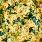 Close-up of Anti-Inflammatory Creamy Coconut Rice with turmeric, spinach, and bok choy in a creamy texture