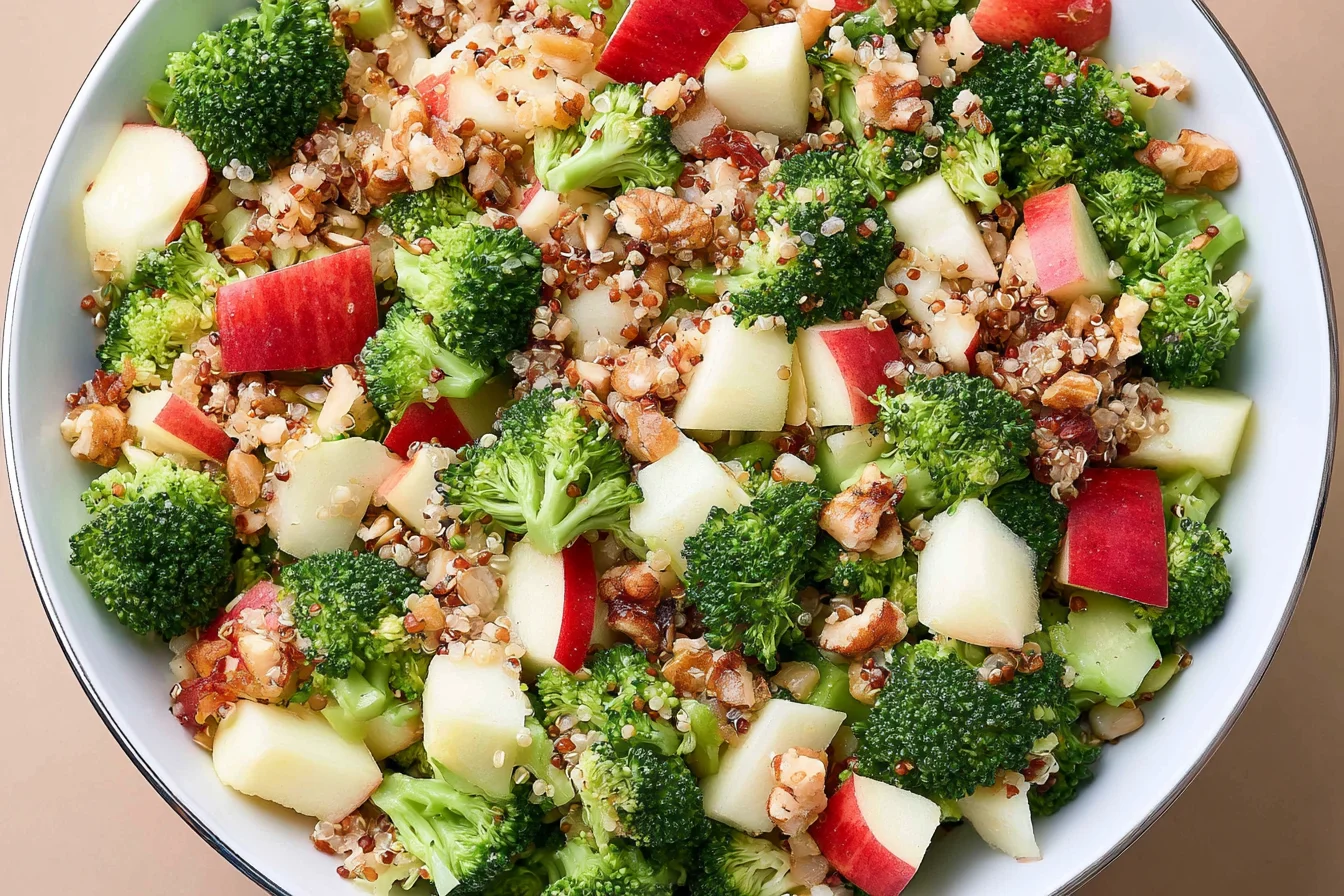 Broccoli Apple Quinoa Salad with fresh broccoli, crisp apples, quinoa, and toasted nuts in a healthy honey mustard dressing