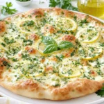 Lemon Pizza with fresh mozzarella, parsley, and lemon slices on a golden crispy crust
