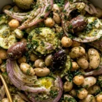 Marinated Zaatar Bean Salad with chickpeas, butter beans, olives, red onion, herbs, and lemon dressing in a bowl
