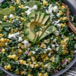 Mexican Street Corn Kale Salad with avocado, cotija cheese, and grilled corn in a bowl
