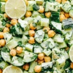 Sunshine Salad with chickpeas cucumber and lime dressing fresh vegan sunshine salad close up