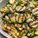 Grilled Zucchini and Corn White Bean Salad with charred zucchini, sweet corn, cannellini beans, and fresh herbs in a light vinaigrette