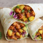 Hawaiian BBQ Chicken Wraps filled with juicy BBQ chicken, pineapple, fresh veggies, and cilantro in soft tortillas
