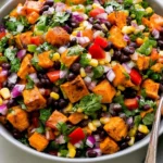 Roasted Sweet Potato Black Bean Salad served with roasted sweet potatoes, black beans, corn, bell peppers, red onion, and fresh cilantro