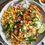 Street Corn Chicken Rice Bowls with grilled chicken, creamy corn, rice, avocado, and chipotle drizzle
