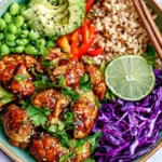 Teriyaki Cauliflower Power Bowls with glazed roasted cauliflower, brown rice, avocado, edamame, red cabbage, and lime