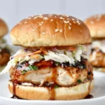 Chicken Teriyaki Burgers with grilled chicken, glossy teriyaki glaze, and crunchy slaw on a sesame brioche bun
