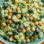 Sunshine Salad with chickpeas cucumber and creamy lime tahini dressing fresh vegan sunshine salad in bowl