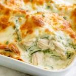 Chicken Alfredo Zucchini Lasagna slice with tender chicken, zucchini layers, creamy Alfredo sauce, and golden melted mozzarella.
