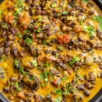 Creamy Black Bean Curry with tender black beans, tomatoes, warm spices, and fresh cilantro in a rich golden coconut sauce.