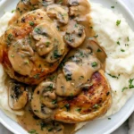 Creamy Mushroom Chicken served over mashed potatoes with rich garlic mushroom sauce