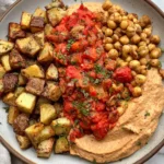 Red Pepper Feta Dip with Roasted Potatoes & Chickpeas served with seasoned roasted red peppers and fresh herbs