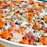 Chicken Bruschetta Casserole with tender chicken, tomatoes, toasted bagel pieces, herbs, and melted mozzarella cheese.