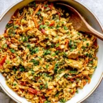 Thai Chicken Cabbage Stir Fry with tender chicken, shredded cabbage, carrots, green onions, cilantro, and savory peanut sauce.