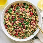 Tuna And White Bean Salad with cannellini beans, tuna, fresh parsley, red onion, sun-dried tomatoes, and lemon dressing.