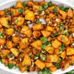 Lentil Sweet Potato Salad with roasted sweet potato cubes, tender lentils, fresh parsley, green onions, and crunchy nuts.