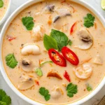 Slow Cooker Tom Kha Soup creamy Thai coconut chicken soup with shrimp, mushrooms, red chili, and fresh cilantro garnish