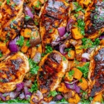 Chili Brown Sugar Chicken and Sweet Potatoes with caramelized chicken breasts, roasted sweet potatoes, red onion, and fresh herbs.