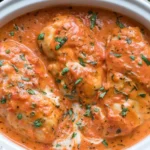 Slow Cooker Creamy Tomato Basil Chicken Breast in a rich tomato cream sauce topped with freshly chopped basil