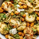 Roasted Cauliflower and Chickpea Pesto Pasta with golden cauliflower, crispy chickpeas, creamy ricotta, fresh herbs, and basil pesto.