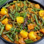 Green Bean Curry with tender potatoes, fresh green beans, herbs, and a rich, aromatic spiced sauce.