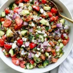 Mediterranean Lentil Salad with lentils, cucumber, cherry tomatoes, feta, Kalamata olives, red onion, and fresh herbs