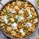 Roasted Cauliflower and Chickpea Pesto Pasta with crispy chickpeas, golden cauliflower, creamy ricotta, fresh herbs, and basil pesto.