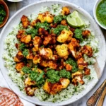 Roasted Cauliflower with Chimichurri Rice topped with golden roasted cauliflower, fresh herbs, and vibrant green chimichurri sauce