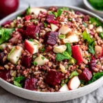 Buckwheat Salad With Beets & Apples featuring roasted red beets, crisp apples, toasted walnuts, fresh herbs, and tender buckwheat in a ceramic bowl.