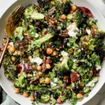 Roasted Broccoli and Chickpea Salad with crispy chickpeas, roasted broccoli, feta, fresh herbs, dates, and lemon dressing.